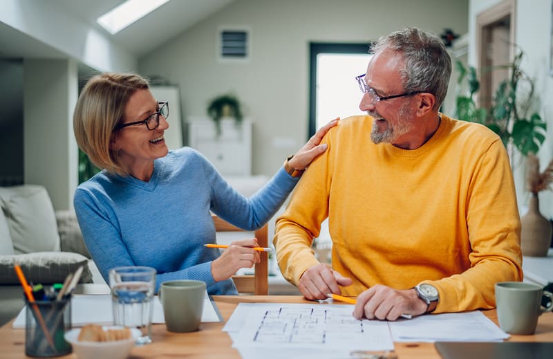 Senior couple speaking with a loan advisor
